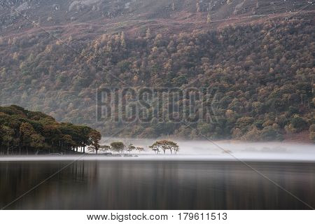 Stunning Winter Foggy Sunrise On Crummock Water In Lake District England