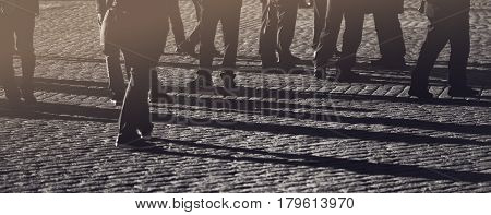 Crowd group of people on the street pedestrians walking on public location general public concept for community and population themes selective focus