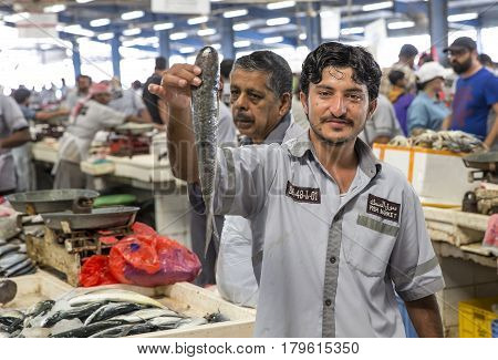 Dubai UAE 31st March 2017: man selling fish at a Deira fish market