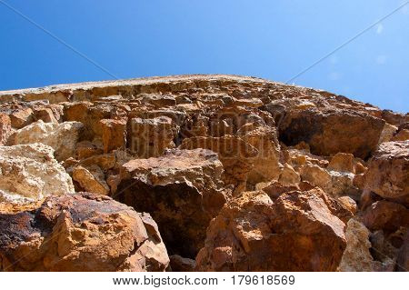 The wall of the old fortress photographed from below closeup.