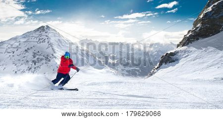 Man Skiing On The Prepared Slope With Fresh New Powder Snow In Alps