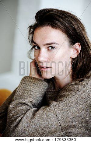 indoor portrait of beautiful feminine thoughtful young women alone in the room.