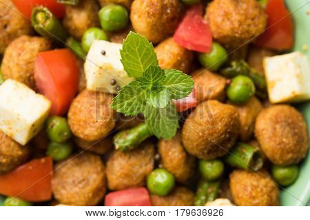 Soya chunks 65 or soya chunk fry is a healthy snack, easy to cook, protein rich, vegetarian dish ideal for starters. popular indian food. selective focus
