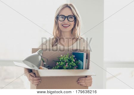 Concept Of Promotion At Work. Young Dreaming Pretty Smiling Woman In Glasses Holding Her Belongings