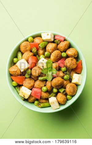 Soya chunks 65 or soya chunk fry is a healthy snack, easy to cook, protein rich, vegetarian dish ideal for starters. popular indian food. selective focus