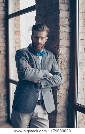 Portrait Of Stylish Hipster Minded Brutal Young Man With Bow-tie, Red Mustache, Heavy Thick Beard An