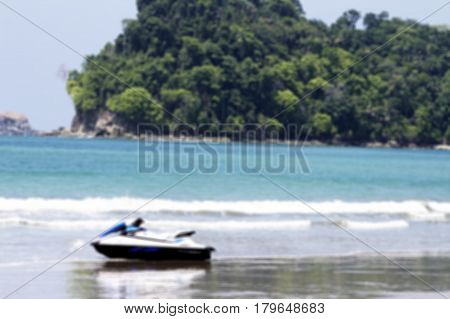 Water motorcycle on the ocean with a beautiful view in blurred for background