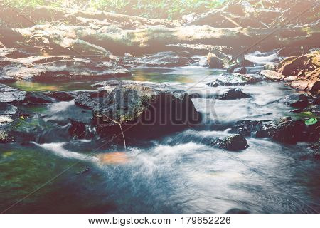 Wallpaper nature Waterfall stream. Water streams of natural forests. thailand Tropical zone