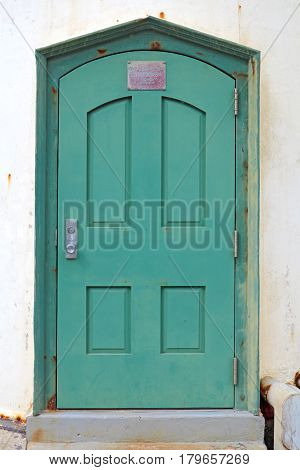 MONTARA CALIFORNIA - MARCH 16 2015: Door to the lighthouse with plaque describing construction dates Point Montara Fog Signal and Light Station off of California Highway 1 south of San Francisco.