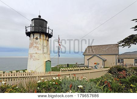 MONTARA CALIFORNIA - MARCH 16 2015: Lighthouse displays and entrance to the Point Montara Lighthouse Hostel off of California Highway 1 approximately 25 miles south of San Francisco on a cloudy day.