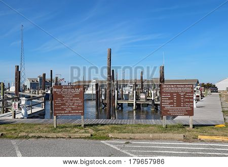 NAGS HEAD NORTH CAROLINA - FEBRUARY 20 2017: Signs and schedules for charter fishing boats into the waters of Pamlico Sound and the Atlantic Ocean from the Oregon Inlet Fishing Center.