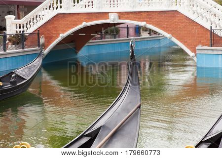 Hua Hin Venice. Gandols in the canal on the background of the bridge.