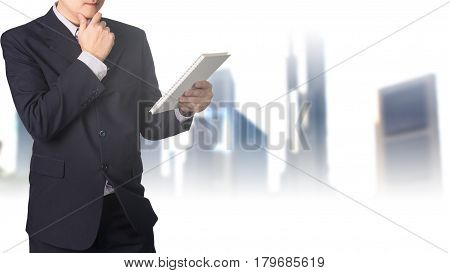 Double Exposure Confident Asian Businessman Reading Notebook Or Document File With Cityscape On Blur
