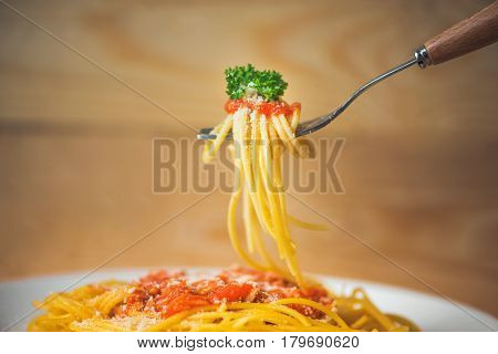 Close-up Of Asta Spaghetti With Tomato Sauce, Olives And Garnish. Italian Food.