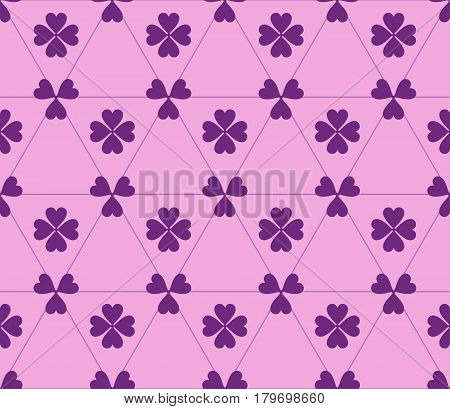 Seamless colored pattern. Print of purple clovers four and three leaves and lines of triangles on pink color background.