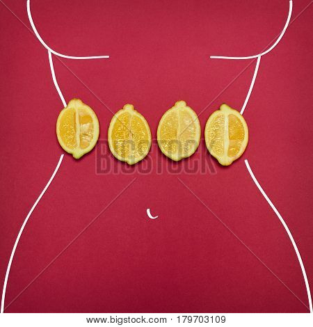 The pop art collage of female body ant fresh lemons on red background. Concept of diet and Healthy lifestyle