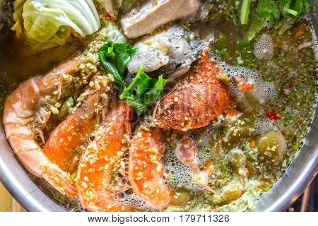 Seafood spicy hot pot crab prawn fish squid tumyum