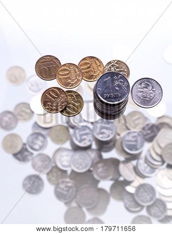A Handful Of 10-kopeek  And One Russian Rouble  Coins Above Scattering Of Coins