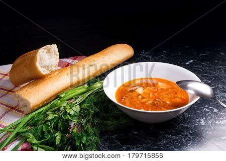 Vegetables And Meat In Red Beetroot Soup Or Borsch In White Plate On Dark Marble Background.