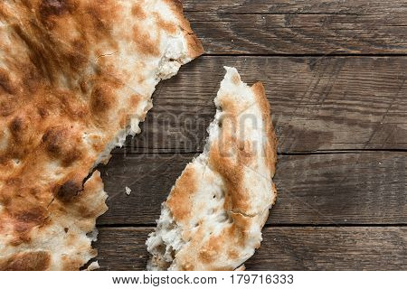 Traditional asian bread. Flatbread on wooden background