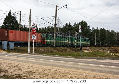 Belarus Krupki - 29.03.2017: Railroad crossing the locomotive of freight train