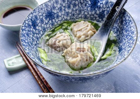 Traditional Chinese Wan Tan Soup as close-up in a bowl