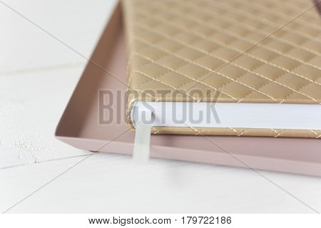 Elegant pink gold composition with notebook and tray