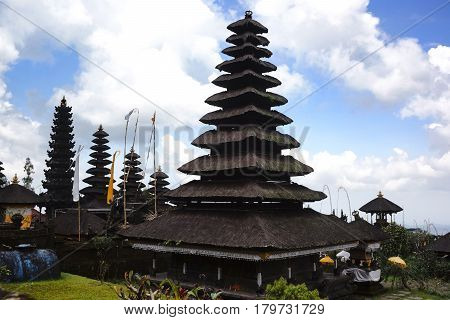 Black hindu temple rooftop building landscape at the celebration day of Galungan in the afternoon Bali Indonesia.