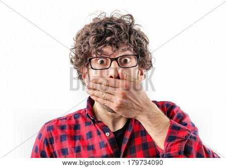 Spellbound guy covering his mouth with his hand