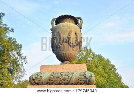 Vase in neoclassical style on Moskovsky Avenue in Saint Petersburg at sunny summer evening.