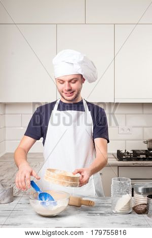 Portrait Of A Male Chef Cook Praparation Pastry On A Kitchen