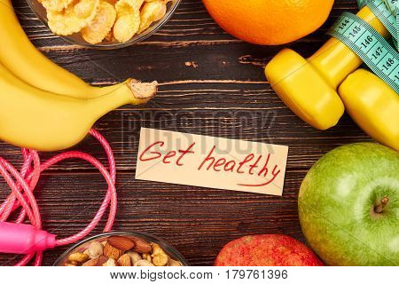 Skipping rope, apple and dumbbells. Start new habits.