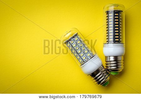 Energy Saving Led Light Bulb On A Yellow Background With Empty Space