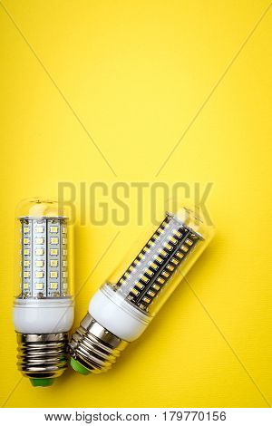 Energy Saving Led Light Bulb On A Yellow Background With Empty Space