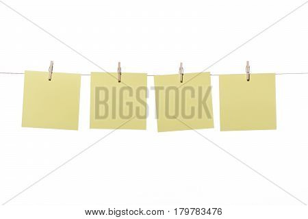 Notes or posit hanging wooden pegs, on white background