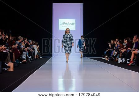 MOSCOW RUSSIA - MARCH 22 2017: Model walk runway for LA REDOUTE & PLUS SIZE MOSCOW catwalk at Autumn-Winter 2017-2018 Moscow Fashion Week. Plus-size fashion models.