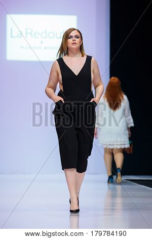 MOSCOW RUSSIA - MARCH 22 2017: Model walk runway for LA REDOUTE & PLUS SIZE MOSCOW catwalk at Autumn-Winter 2017-2018 Moscow Fashion Week. Plus-size fashion models.
