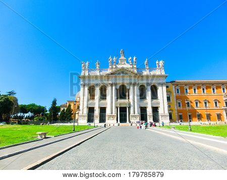 People are entering into basilica di san giovanni in laterano at sunny day