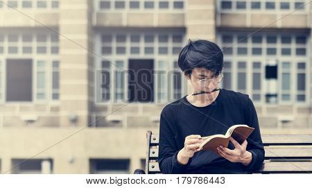 Asian Guy Making Notes Diary Notebook