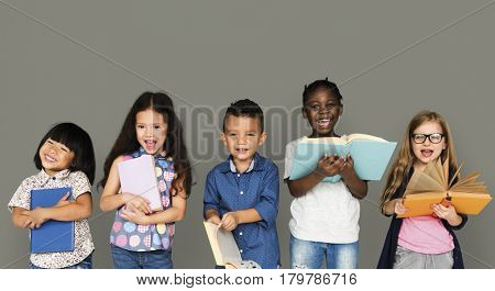 Group of Diverse Kids Reading Books Together Studio Portrait