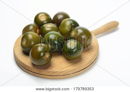 Tomate kumato on a table for the kitchen