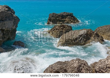 Amazing seascape of blue waters of Megali Petra Beach, Lefkada, Ionian Islands, Greece