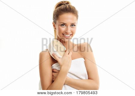 Woman with bath sponge isolated on white with healthy skin