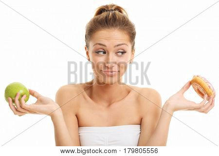 Adult woman posing with donuts over white background