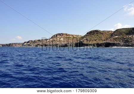Blue sea and characteristic caves of Cala Luna Golfo di Orosei Sardegna or in Sardinia Italy