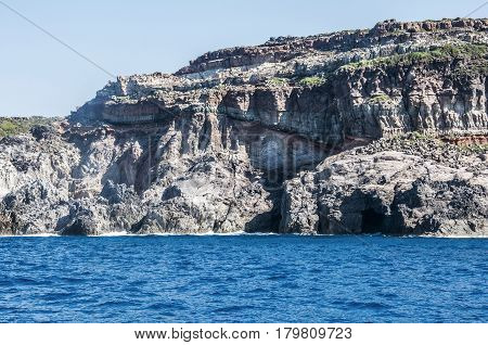 Blue sea and characteristic caves of Cala Luna Golfo di Orosei Sardegna or in Sardinia Italy