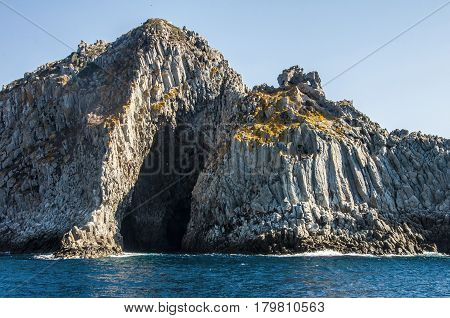 Blue sea and characteristic caves of Cala Luna Golfo di Orosei Sardegna or in Sardinia Italy
