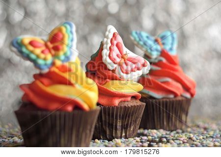 Easter cupcakes. Chocolate cupcakes with multicolored frosting. Selective focus.