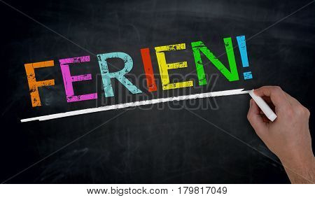Ferien (in German Holiday) Is Written By Hand On Blackboard