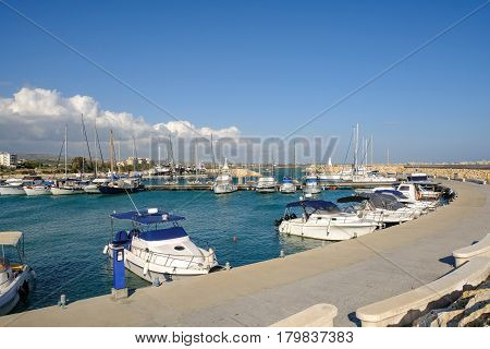 Marina with boats moored at Zygi, Cyprus, taken on a bright sunny Spring day on a visit to this small fishing village.